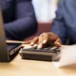 events - Man and woman reviewing bills and financial documents